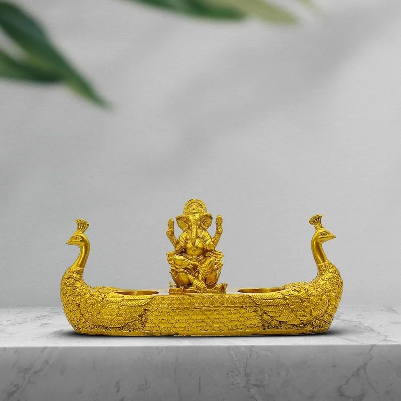 Lord Ganesha Idol with Peacock Diya Stand: Golden Polyresin Ganpati Home Decor
